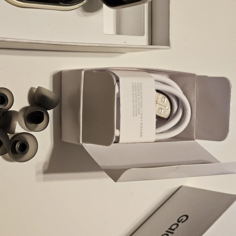 Samsung Galaxy Buds2, black in a white case.